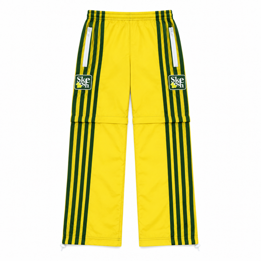 Skids V2 TrackPants in yellow with green stripes, flat lay on white